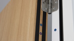 Hallway in a commercial building featuring fire doors and emergency exit signs, demonstrating commercial fire safety measures.