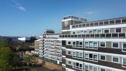 Multi-story building with designated fire door placements enhancing residential fire safety.